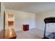 Brightly lit exercise room featuring a treadmill, carpeting, cabinets and a doorway to an adjacent space at 2598 Bryant Dr, Fort Mill, SC 29707