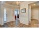 Inviting foyer with hardwood floors, white wainscoting, and a view into an office at 2598 Bryant Dr, Fort Mill, SC 29707