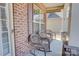 Inviting front porch with rocking chairs, brick pillars, and a view of the neighborhood at 2598 Bryant Dr, Fort Mill, SC 29707
