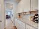 Butler's pantry with granite counters, wine storage and conveniently located near dining area at 2598 Bryant Dr, Fort Mill, SC 29707