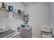 Functional laundry room with modern washer and dryer, shelving, and laundry supplies storage at 2598 Bryant Dr, Fort Mill, SC 29707