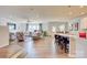 Open concept living room flows into kitchen, featuring hardwood floors and ample natural light at 2598 Bryant Dr, Fort Mill, SC 29707