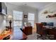Well-lit home office with built-in shelving, desk, and a comfortable executive chair at 2598 Bryant Dr, Fort Mill, SC 29707