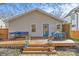 Inviting backyard with a wood deck, patio seating, and landscaped backyard perfect for entertaining at 2911 N Myers St, Charlotte, NC 28205