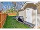 Lush, green fenced backyard with access door and space for outdoor appliances at 2911 N Myers St, Charlotte, NC 28205