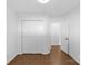 Bedroom with wood-look floors, white trim, and a closet at 2911 N Myers St, Charlotte, NC 28205