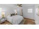 Cozy bedroom with a ceiling fan, hardwood floors and natural lighting at 2911 N Myers St, Charlotte, NC 28205