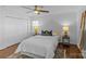 Bedroom featuring ceiling fan, hardwood floors, and double door closet at 2911 N Myers St, Charlotte, NC 28205