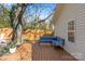 Wooden deck furnished with cozy seating and a view of the backyard at 2911 N Myers St, Charlotte, NC 28205