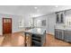 Bright and open floor plan showcases the kitchen with an island and the dining area at 2911 N Myers St, Charlotte, NC 28205