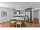 Bright kitchen with stainless steel appliances, gray cabinetry, and a central island with seating for casual dining at 2911 N Myers St, Charlotte, NC 28205