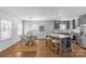 Well-lit kitchen with stainless steel appliances, gray cabinetry, and an adjacent dining area at 2911 N Myers St, Charlotte, NC 28205