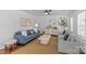Bright living room with stylish furnishings, a modern ceiling fan, and beautiful hardwood floors at 2911 N Myers St, Charlotte, NC 28205