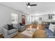 Spacious living area showcasing hardwood floors, comfortable seating, and a dining area at 2911 N Myers St, Charlotte, NC 28205