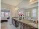 Bright bathroom featuring a double sink vanity with granite counters and a separate shower at 3308 Oscar Dr, Matthews, NC 28105
