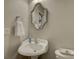 Charming half bathroom with a decorative mirror and pedestal sink at 3308 Oscar Dr, Matthews, NC 28105