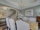 Elegant dining room featuring a marble table, chandelier, and ample natural light at 3308 Oscar Dr, Matthews, NC 28105
