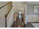 Spacious hallway leads to the living areas with dark wood floors and stairway at 3308 Oscar Dr, Matthews, NC 28105