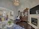 Open-concept living area with fireplace, stylish furniture, and easy access to other parts of the home at 3308 Oscar Dr, Matthews, NC 28105