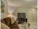 Relaxing living room featuring comfortable seating and a glass coffee table at 3308 Oscar Dr, Matthews, NC 28105