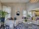 Cozy living room with a large sectional sofa, stylish rug, and plenty of natural light at 3308 Oscar Dr, Matthews, NC 28105