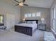 Well-lit main bedroom with a bed, ample windows, and tasteful decor at 3308 Oscar Dr, Matthews, NC 28105