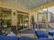 Covered patio area showcasing comfortable seating and views of the landscaped backyard at 3308 Oscar Dr, Matthews, NC 28105