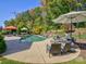 Beautiful backyard featuring a large pool, lounge chairs and manicured landscaping at 3308 Oscar Dr, Matthews, NC 28105
