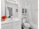 Bright bathroom with a white vanity, toilet, and shower with a white curtain at 3643 Melrose Cottage Dr, Matthews, NC 28105