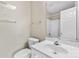 Compact bathroom featuring a white sink and mirror with overhead lighting at 3643 Melrose Cottage Dr, Matthews, NC 28105