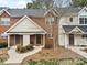 Charming townhome with brick and siding exterior, featuring a landscaped front yard and inviting entrances at 3643 Melrose Cottage Dr, Matthews, NC 28105