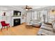 Cozy living room with a fireplace, built-in shelving, and stylish decor, offering a comfortable and inviting ambiance at 3643 Melrose Cottage Dr, Matthews, NC 28105