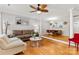 Spacious living area with hardwood floors, open to the dining room and kitchen, perfect for modern living at 3643 Melrose Cottage Dr, Matthews, NC 28105
