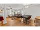 Open-concept living space with hardwood floors, chandelier, and stylish furnishings, creating an inviting atmosphere at 3643 Melrose Cottage Dr, Matthews, NC 28105