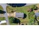 Aerial view of a well-maintained property featuring a home with a large yard and mature trees at 3808 22Nd Street Ne Ct, Hickory, NC 28601