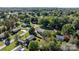 Aerial view of home nestled among mature trees in a Gathering-friendly neighborhood at 3808 22Nd Street Ne Ct, Hickory, NC 28601