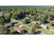Aerial view of home in a suburban neighborhood featuring mature trees and green lawns at 3808 22Nd Street Ne Ct, Hickory, NC 28601
