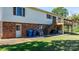 Backyard view with a raised wooden deck and steps leading to a concrete patio, great for outdoor entertaining at 3808 22Nd Street Ne Ct, Hickory, NC 28601