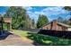 Fenced backyard featuring a combination of lawn and mature trees, creating a private outdoor space at 3808 22Nd Street Ne Ct, Hickory, NC 28601