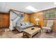 The basement has carpeted stairs and wood paneling, with a seating area and a window at 3808 22Nd Street Ne Ct, Hickory, NC 28601