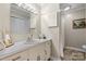 Bathroom with a vanity and a large mirror, along with a shower behind a curtain at 3808 22Nd Street Ne Ct, Hickory, NC 28601