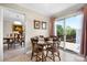Cozy breakfast nook with a wood table and chairs, next to a sliding glass door to a wood deck at 3808 22Nd Street Ne Ct, Hickory, NC 28601
