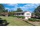 Charming split-level home boasts a well-maintained lawn and attached two-car garage at 3808 22Nd Street Ne Ct, Hickory, NC 28601