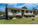 Split-level home with mature landscaping, brick accents, and a welcoming entrance at 3808 22Nd Street Ne Ct, Hickory, NC 28601