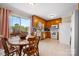 Kitchen featuring wooden cabinets, laminate countertops, and a dining table with chairs at 3808 22Nd Street Ne Ct, Hickory, NC 28601
