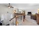 Spacious living room with staircase, neutral walls, ceiling fan, and comfortable seating at 3808 22Nd Street Ne Ct, Hickory, NC 28601