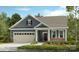 Charming single-story home with a well-manicured lawn, covered porch and two-car garage at 407 Sunharvest Ln, Indian Trail, NC 28079