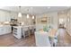 Spacious kitchen featuring a central island, stainless steel appliances, and breakfast bar seating at 407 Sunharvest Ln, Indian Trail, NC 28079