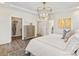 Well-lit bedroom with large windows, ample closet space, and modern furnishings at 407 Sunharvest Ln, Indian Trail, NC 28079