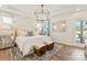 Serene main bedroom with elegant lighting, neutral tones, and ensuite bathroom access at 407 Sunharvest Ln, Indian Trail, NC 28079